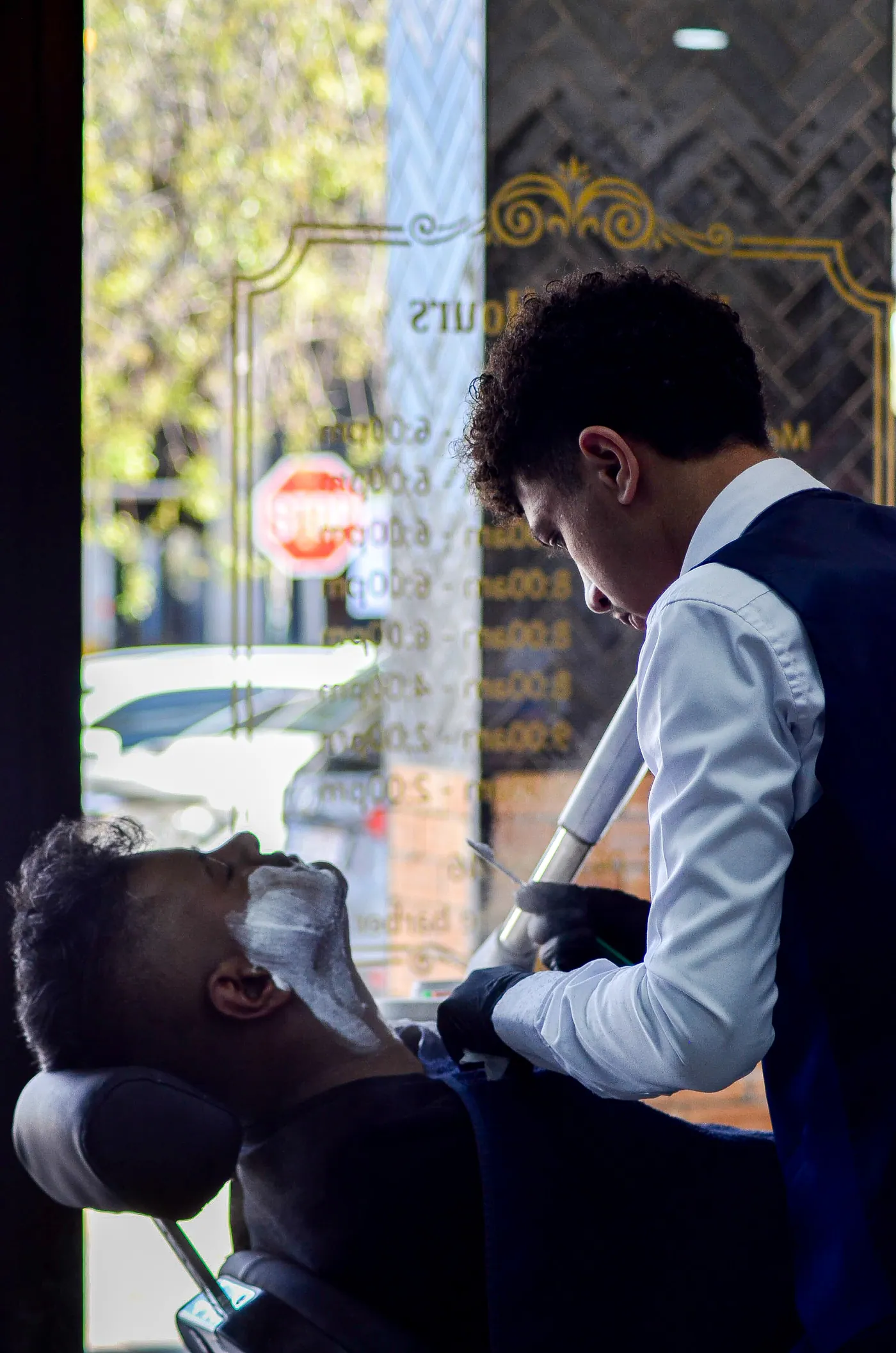 A hot towel shave underway at Mr Martin The Barber in Alberton
